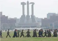  ?? Reuters ?? Soldiers walk in front of the Monument to the Foundation of the Workers’ Party in Pyongyang, North Korea, on Sunday. —