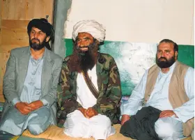  ?? Zubair Mir / AFP / Getty Images 1991 ?? Jalaluddin Haqqani (center) sat between two of his top commanders in 1991 at his Pakistani base in Miranshah. His son Sirajuddin is the group’s new leader.