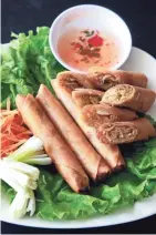  ??  ?? The slender, tightly wrapped eggrolls at Jackie's Café come with chicken, pork or vegetable filling.