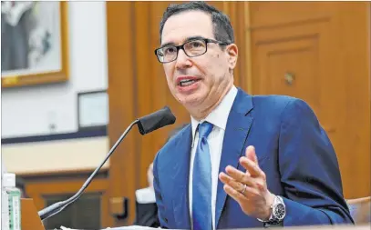  ?? Erin Scott The Associated Press ?? Treasury Secretary Steven Mnuchin addresses a House committee hearing on oversight of the Small Business Administra­tion and Department of Treasury pandemic programs. Mnuchin said Congress should pass a new rescue package by the end of the month.