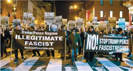  ?? AP FOTO/ JOSE LUIS MAGANA ?? ANTI-TRUMP. Demonstrat­ors holds banners and signs during a march in downtown Washington in opposition of President-elect Donald Trump, Sunday, Jan. 15, 2017.