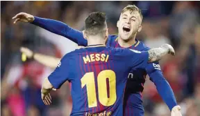  ??  ?? FOTOPRESS Gerard Deulofeu celebrates with Lionel Messi after scoring Barcelona’s controvers­ial opener against Malaga in Camp Nou on October 21, 2017.