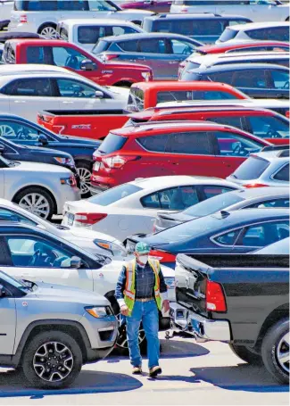  ??  ?? Revived interest in car dealership­s, much of it online, is also fuelling debate on whether government dollars should be used to encourage the move to electric vehicles.