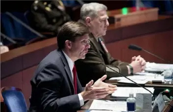  ?? Michael Reynolds/Associated Press ?? Defense Secretary Mark Esper testifies during a House Armed Services Committee hearing Thursday on Capitol Hill in Washington while Chairman of the Joint Chiefs of Staff Gen. Mark Milley, right, listens.