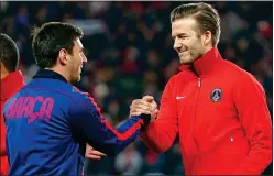  ??  ?? SHAKE ON IT: Beckham wants Messi to end his glittering career at Inter Miami