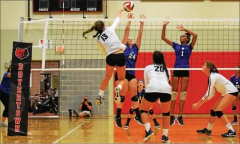  ??  ?? Bouertown’s Emma Ludwig (13) follows through on a kill during Thursday’s win against Norristown.