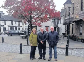  ??  ?? Out and about Joe Fagan, centre, East Mains Community Council secretary Jean Aitken and chair Bill Arthur