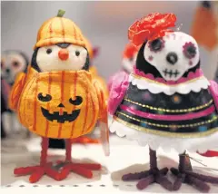  ??  ?? A stuffed toy owl dressed up like a pumpkin is displayed in the Halloween section called ‘Hyde and Eek’ at a Target department store in Pembroke Pines, Florida.