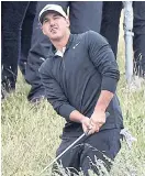  ??  ?? Brooks Koepka chips from the rough on the third hole.