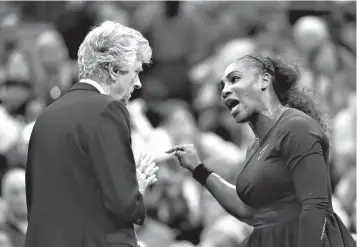  ?? Associated Press ?? ■ Serena Williams, right, talks with referee Brian Earley during the women's final of the U.S. Open tennis tournament against Naomi Osaka on Saturday in New York.