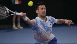  ?? DITA ALANGKARA — THE ASSOCIATED PRESS ?? Novak Djokovic of Serbia plays a forehand return to Stefanos Tsitsipas of Greece during the men's singles final at the Australian Open in Melbourne, Australia, on Sunday.