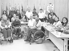  ??  ?? The writer with participan­ts of the AUN-DPPnet Accessibil­ity and Universal Design Training Programme.