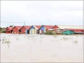  ?? HEAN RANGSEY ?? Houses are flooded in Prek Chey village in Phnom Penh’s Dangkor district. Some 800,000 people in the country’s 19 provinces were affected by the floods.