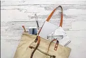  ?? Carol Yepes Getty Images ?? A MOTHER’S BAG can be a reminder of a time when a parent was needed in their child’s early life.