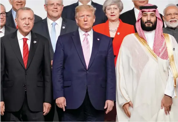  ?? (Kevin Lamarque/Reuters) ?? TURKEY’S PRESIDENT Recep Tayyip Erdogan, US President Donald Trump and Saudi Arabia’s Crown Prince Mohammed bin Salman attend a photo session at the G20 leaders summit in Japan in June.