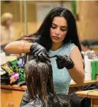  ?? John Bazemore /AP ?? A 10-year study of nearly 34,000 women finds an increased risk of uterine cancer linked to chemicals used to straighten hair.
