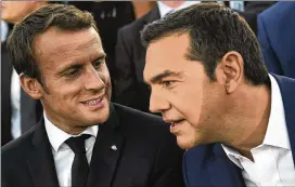  ?? ARIS MESSINIS / POOL ?? French president Emmanuel Macron (left) , and Greek Prime Minister Alexis Tsipras arrive at Pnyx hill in Athens, Thursday. Macron called on members of the European Union to reboot the 60-year-old bloc with sweeping political reforms.