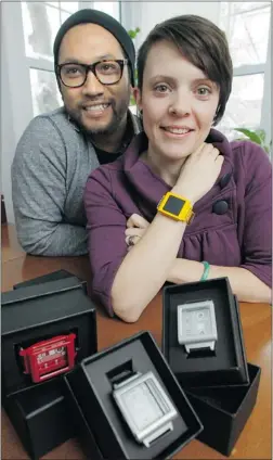  ?? PHOTOS: PAT MCGRATH/ POSTMEDIA NEWS ?? Dominic Coballe and Chrystale Ladouceur of Ottawa have invented a wrist case that holds an ipod Nano. It sells for about $ 150.