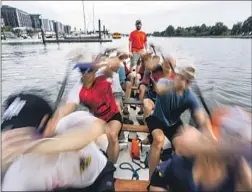  ?? Kent Nishimura Los Angeles Times ?? THE DC Dragon Boat Club practices July 6 in the Washington Channel. To make the team, one journalist realized she had to change her lifestyle.