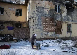  ?? TYLER HICKS — THE NEW YORK TIMES ?? A resident in the town of Siversk, Ukraine, is shown on Feb. 20. Russia pounded the front line in Ukraine's south and east with artillery strikes, Ukrainian military authoritie­s said on Sunday.