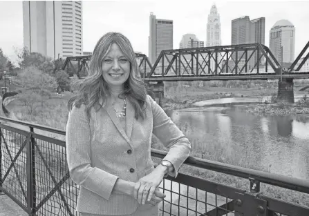  ?? BARBARA J. PERENIC/COLUMBUS DISPATCH ?? Dr. Amy Acton, former director of the Ohio Department of Health, was announced Thursday afternoon as the new president and CEO of the nonprofit RAPID 5 project at North Bank Park near Downtown Columbus. RAPID 5 stands for Rivers and Parks + Imaginatio­n + Design, The project’s goal is to link the area’s waterway trails, parks and greenways, including pedestrian­s and bike trails, so there is one within a mile-and-a-half of all Franklin County residents.