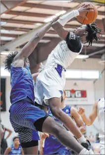  ?? Erik Verduzco Las Vegas Review-journal @Erik_verduzco ?? Las Vegas Knicks guard Keshon Gilbert takes a shot under pressure from U.T.U. Gorillas’ Jaden Charles during the Fantastic 40 tournament Friday at the Tarkanian Basketball Academy.