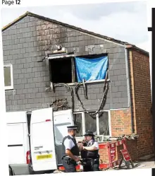  ??  ?? Horror: Police outside Joel’s burned-out home