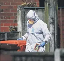  ?? Danny Lawson Press Assn. ?? AN INVESTIGAT­OR searches the property of Salman Abedi, named as the bomber. Islamic State took responsibi­lity for the blast.