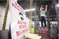  ?? JAKE DANNA STEVENS/THE TIMES-TRIBUNE ?? Ansley O’donnell, 15, of Moscow, Pa., works in preparatio­n for softball season at NEPA Fit Club in Blakely, Pa. State lawmakers are moving to curb the authority of governors to impose health restrictio­ns.