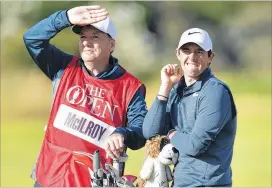  ?? STUART FRANKLIN / GETTY IMAGES ?? Rory McIlroy (right) credited caddie J. P Fitzgerald with reminding him “who I was, basically” after an awful start to Thursday’s fifirst round.