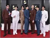  ?? JORDAN STRAUSS — THE ASSOCIATED PRESS ?? BTS arrives at the 64th annual Grammy Awards on April 3 in Las Vegas. The group says they are taking time to focus on solo projects.