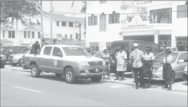  ??  ?? Yours faithfully, Clement J Rohee Guyana Peace Council Police Officers standing guard outside of the Central Housing and Planning Authority yesterday.