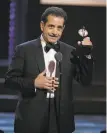  ?? Michael Zorn / Invision ?? Tony Shalhoub accepts the Tony Award for best leading actor in a musical for his work in “The Band’s Visit.”
