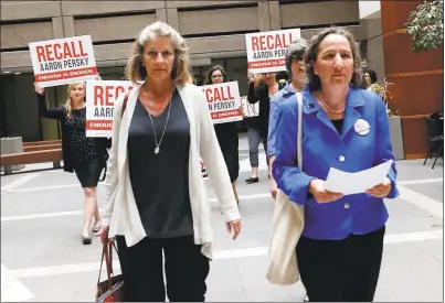  ?? GARY REYES — STAFF ARCHIVES ?? Katherine Spillar and Michele Dauber, left to right, deliver a notice of intent to recall Superior Court Judge Aaron Persky at the Santa Clara County Registrar of Voters office in San Jose in 2017.