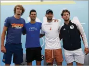  ?? THE ASSOCIATED PRESS ?? Novak Djokovic, second left, poses with Alexander Zverev, left, Grigor Dimitrov, second right, and Dominic Thiem after a press conference prior a charity tournament.