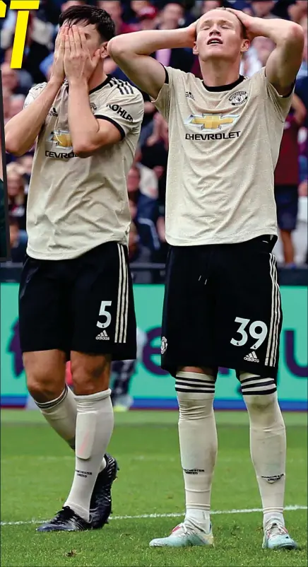  ??  ?? Painful to watch: United’s Harry Maguire and Scott McTominay despair during the dismal display