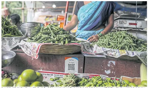  ?? BLOOMBERG ?? A vegetable stall advertises the use of the Google Pay digital payment system in Mumbai, India, in July. India had a record $6.3 billion of funding and deals for technology startups in the second quarter.