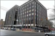  ?? DIGITAL FIRST MEDIA FILE PHOTO ?? Workers revamp overhead structure around One Montgomery Plaza on Swede Street in Norristown March 15, 2016.