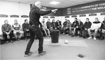  ??  ?? Ian Smith (centre) leads an ‘Offload’ mental health session in the Warrington Wolves dressing room at their stadium in Warrington in this Jan 23 file photo. — AFP photo