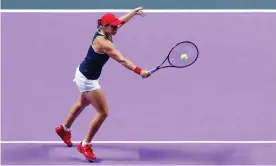  ??  ?? Ashleigh Barty plays a backhand volley during her 6-4, 6-3 victory over Elina Svitolina in the WTA Finals. Photograph: VCG/VCG via Getty Images