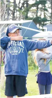  ?? ?? Ricoh Harris-Leota taking part in the archery activity.