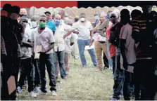  ?? | REUTERS ?? TRUCK drivers queue to get tested for the coronaviru­s at Kenya’s Namanga border crossing with Tanzania.