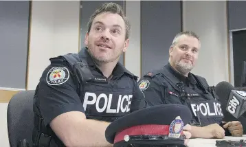  ?? STAN BEHAL/TORONTO SUN/POSTMEDIA NETWORK ?? Constables Josh McSweeney and Ryan Barnett swam through the flooded basement to rescue the trapped men.