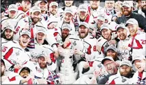  ?? (AP) ?? In this June 7, 2018 file photo, members of the Washington Capitals pose with the Stanley Cup after the Capitals defeated the Golden Knights 4-3 in
Game 5 of the NHL hockey Stanley Cup Finals in Las Vegas.