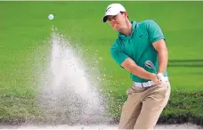  ?? LYNNE SLADKY/THE ASSOCIATED PRESS ?? Rory McIlroy hits from a bunker on the first hole during the third round of the Cadillac Championsh­ip in Doral, Fla., on Saturday.