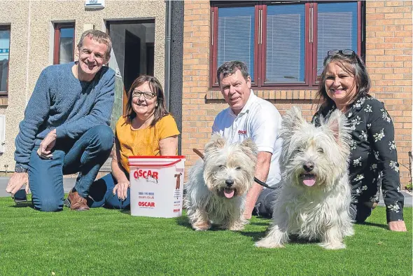  ??  ?? Craig Smith with Lorraine and Colin Clement and Alison Carr with Westies Archie and Charlie.