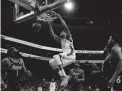  ?? MATT SLOCUM/AP ?? The Bucks' Giannis Antetokoun­mpo dunks against the 76ers on Tuesday in Philadelph­ia. Milwaukee won 118-116.