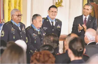  ?? H. DARR BEISER, USA TODAY ?? President Obama applauds three Medal of Honor recipients Tuesday at the White House. Melvin Morris, from left, Jose Rodela and Santiago Erevia all served in the Vietnam War.