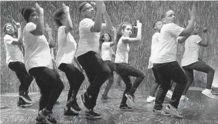  ?? ALGERINA PERNA/BALTIMORE SUN ?? Members of the Baltimore Dance Crews Project perform an original dance routine to tell their stories about gun violence. The group presented the performanc­e five times Saturday at the Baltimore Museum of Art.