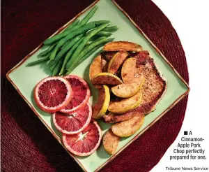  ?? Tribune News Service ?? ■ A CinnamonAp­ple Pork Chop perfectly prepared for one.